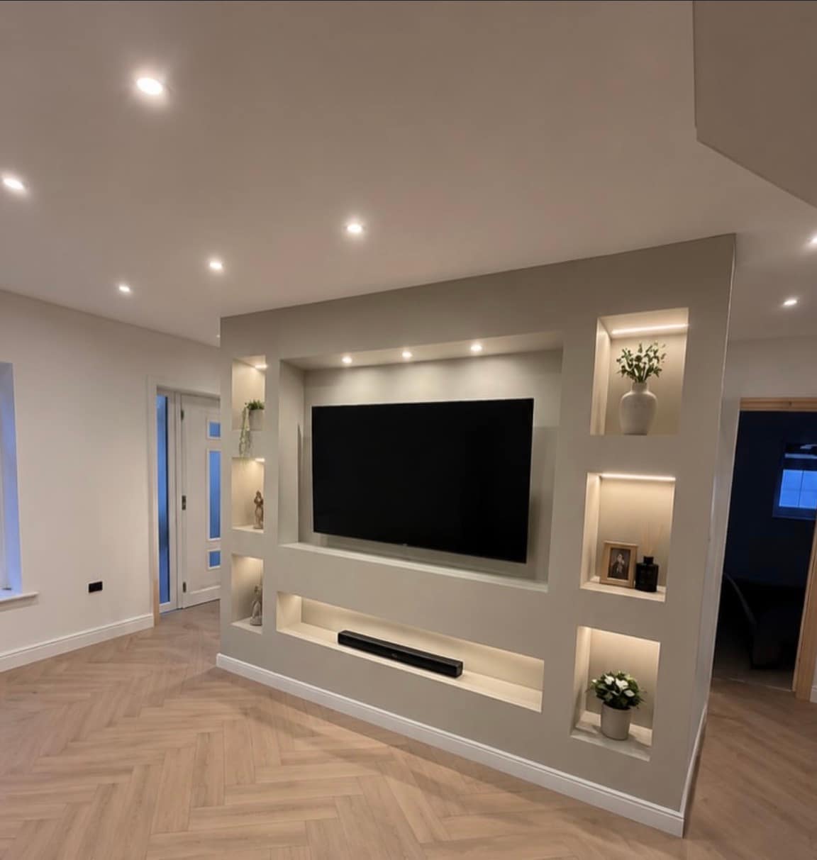 Bespoke media wall with lit display niches